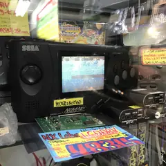 Retro Sega gaming hardware and memorabilia display in Japan
