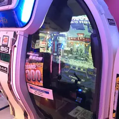 Japanese arcade game cabinet with illuminated controls