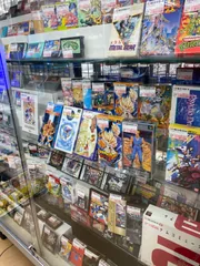 Large glass display case filled with retro Japanese video games