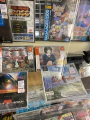 Display case of retro Japanese video games and classic titles